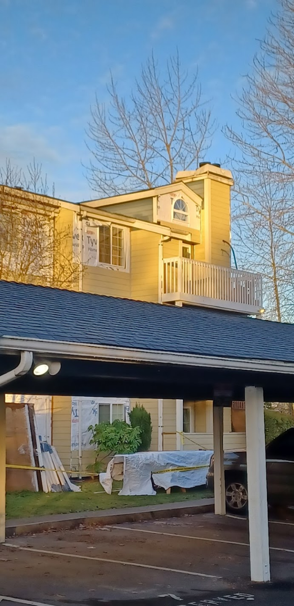 Elegant exterior renovation with new siding and balcony