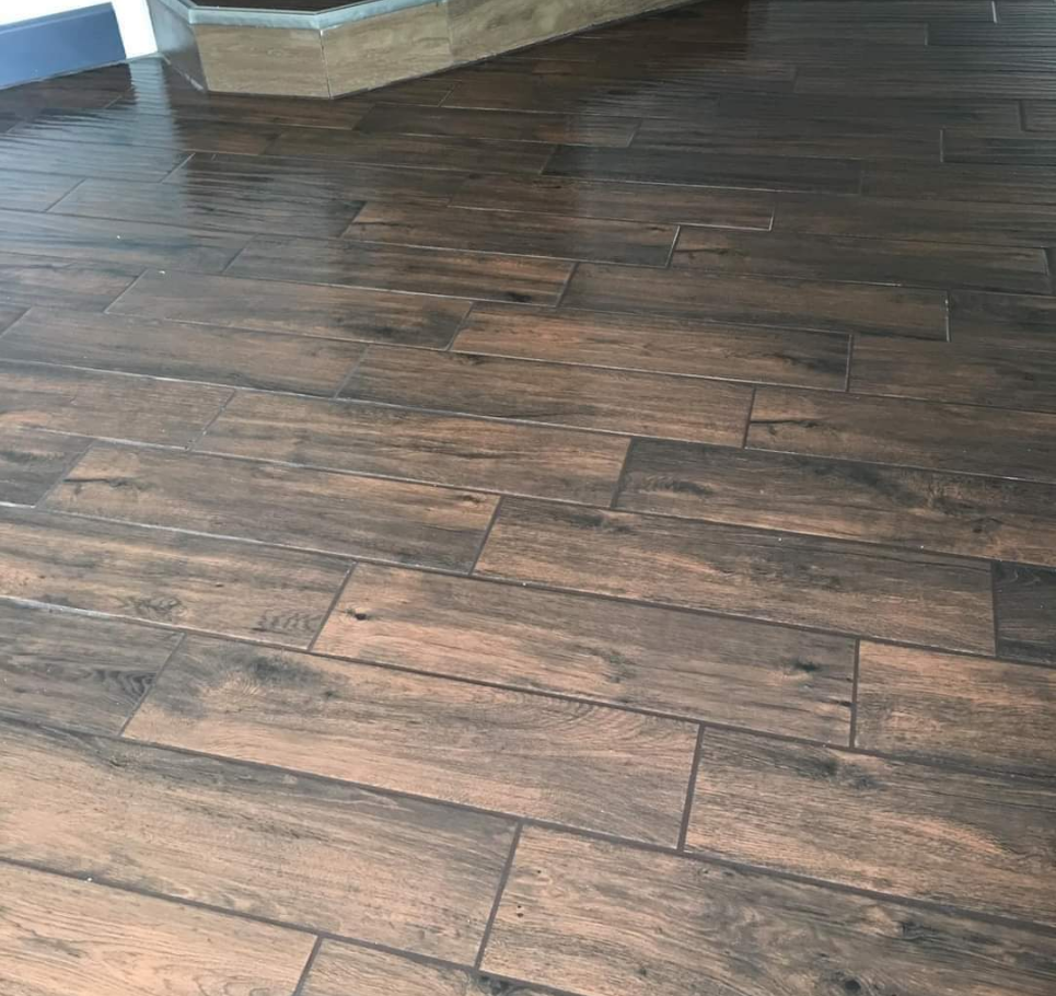 Close-up of rich wood-style flooring with a polished finish