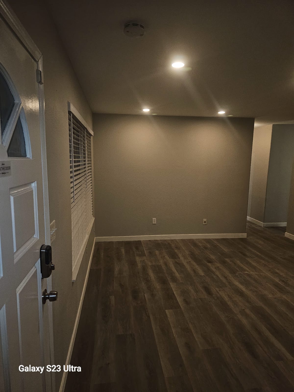 Spacious renovated living area with recessed lighting
