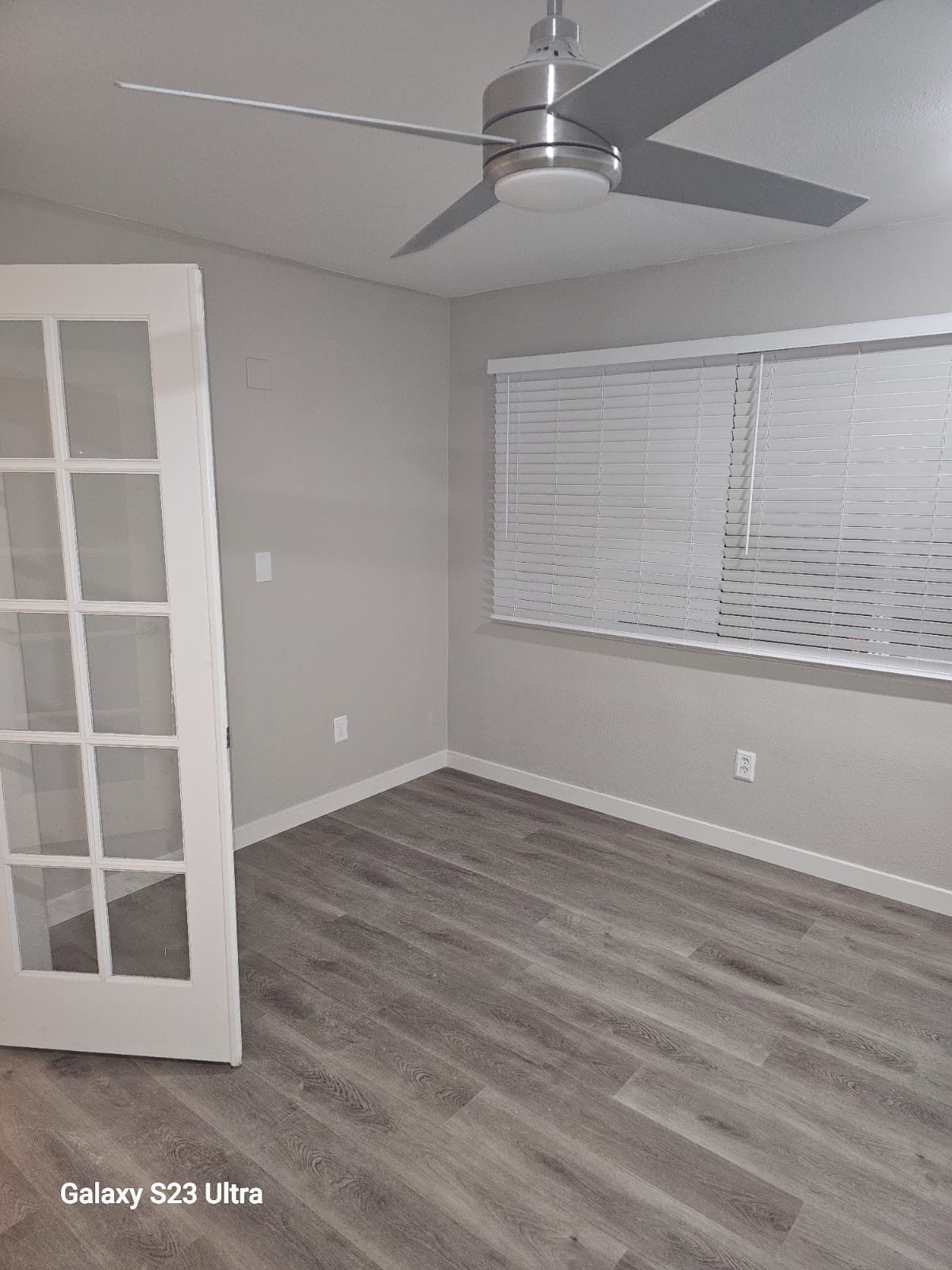 Entryway with sophisticated flooring and lighting