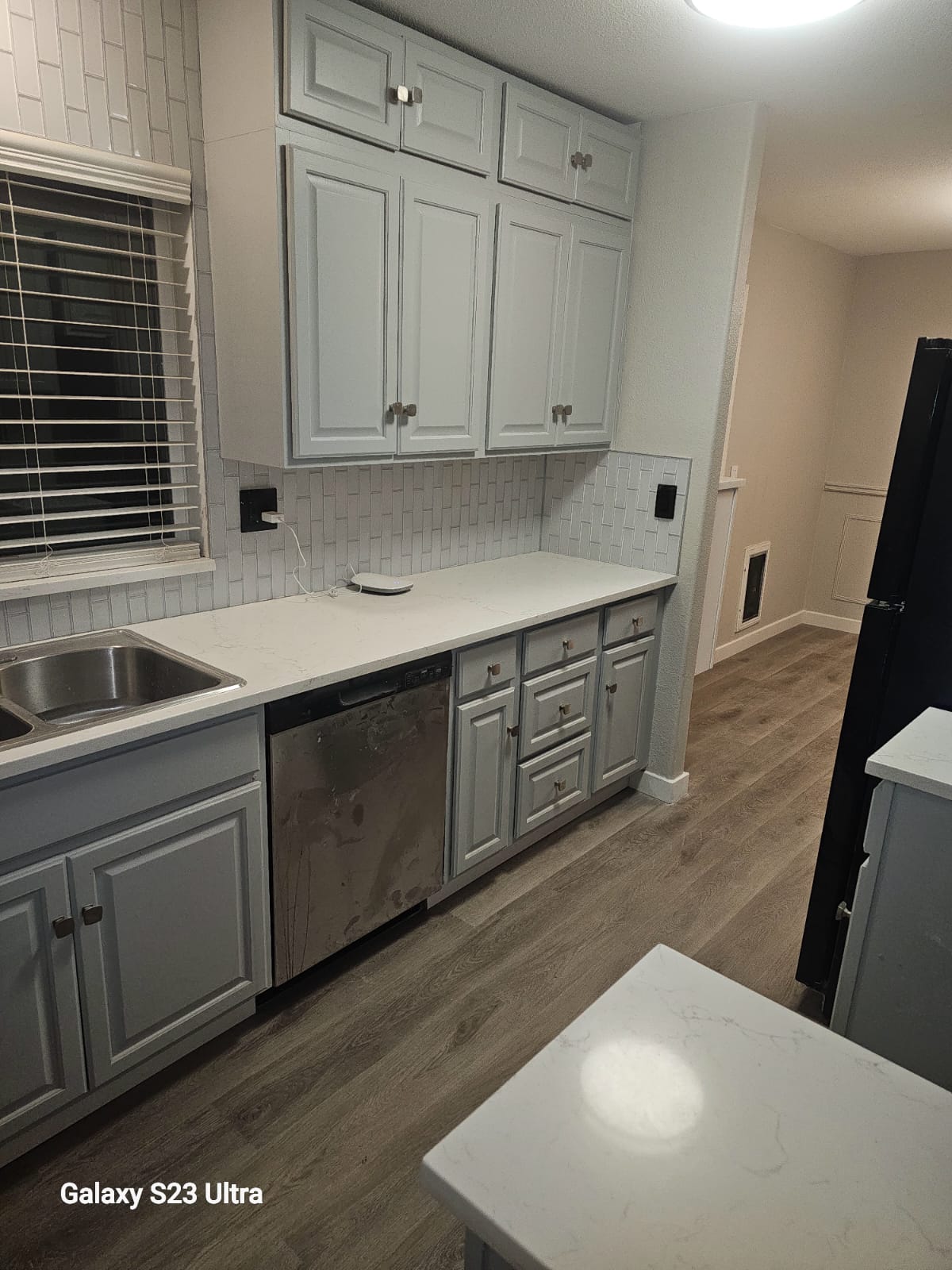 View of kitchen sink and modern faucet