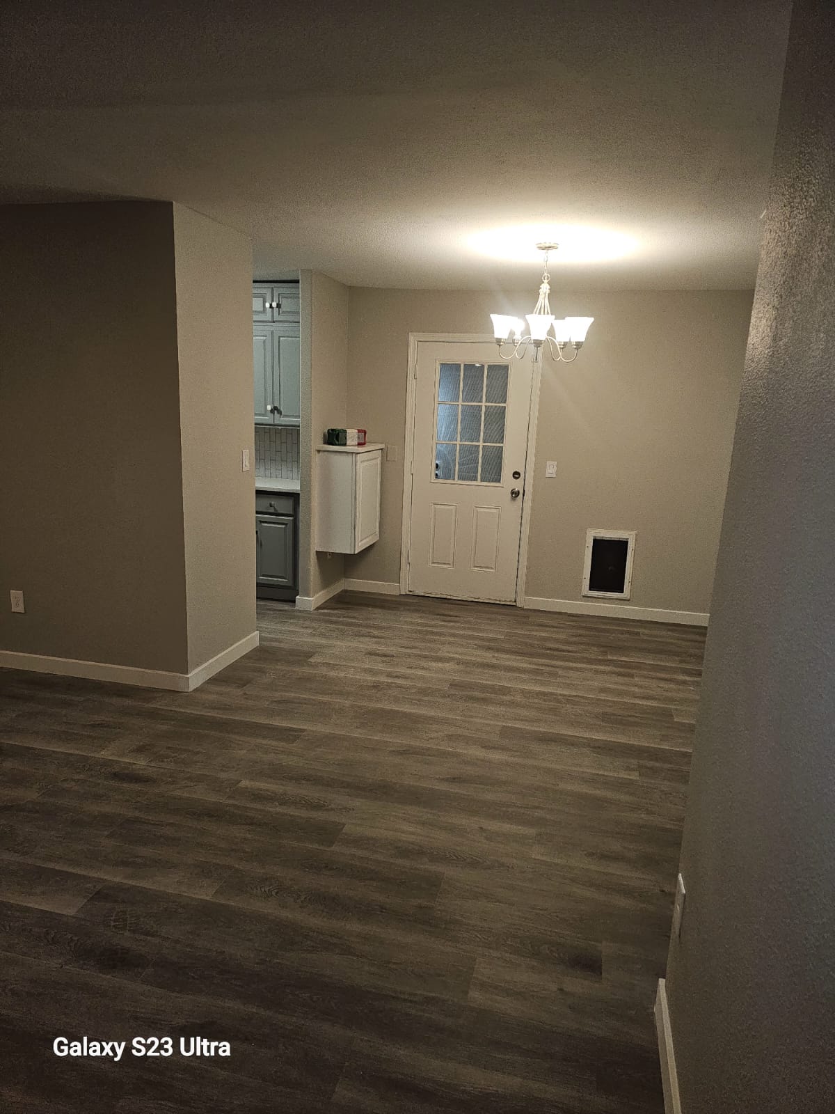 Spacious renovated kitchen with updated lighting