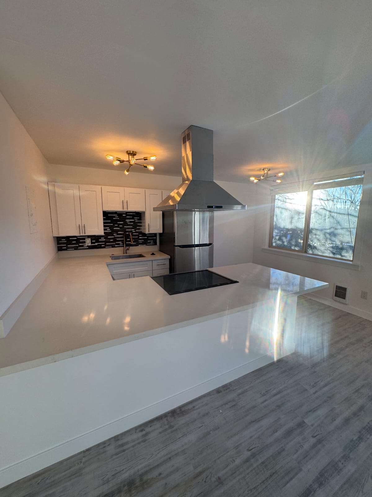 Open kitchen layout with stainless steel appliances