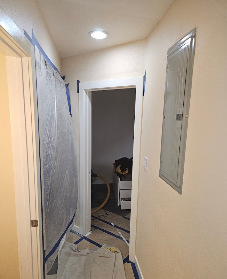 Narrow corridor carefully prepared for a smooth painting process